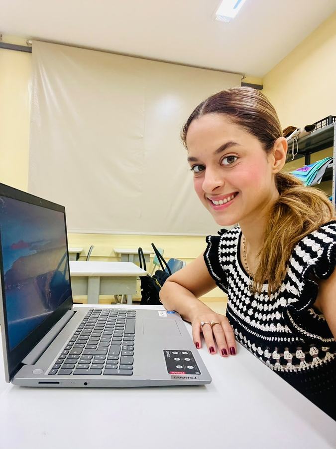 Beatriz preparing a lesson on her laptop